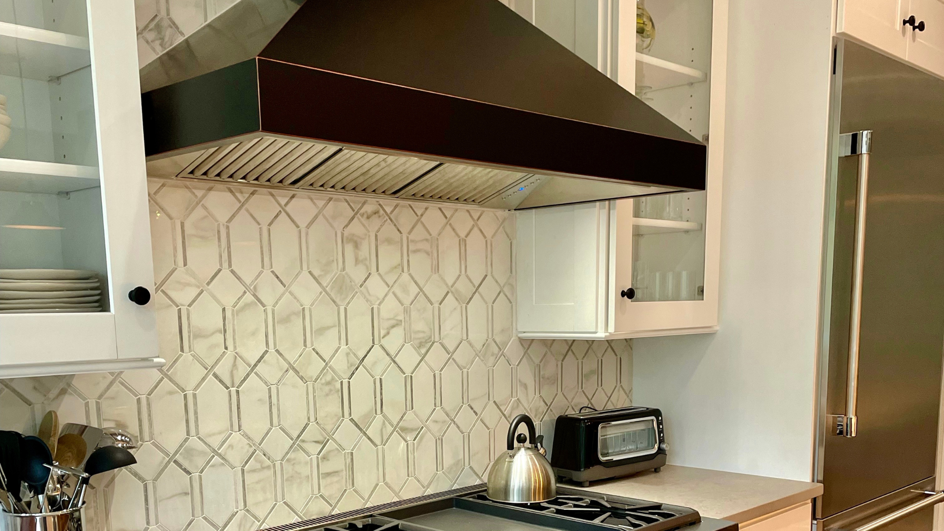 Custom tile backsplash with range hood