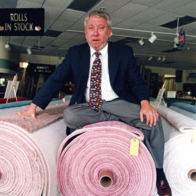 bob wagner's old photo sitting on carpet rolls